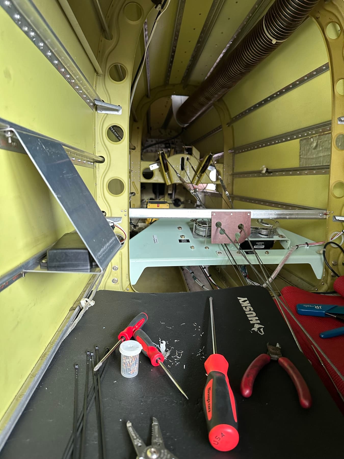Behind-panel structure